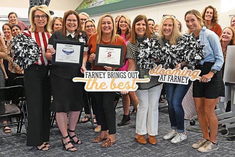 Heather Motzny, Sampson Elementary School principal, second from left, and Dr. Tricia Reilly, Farney principal.